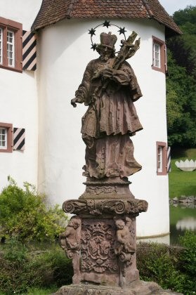 Nepomuk statue in front of the moated castle in Inzlingen
